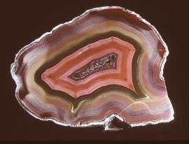 Quartz var. agate, Idar-Oberstein, Germany. Agate, Idar-Oberstein, Germany. A colorful agate from one of the World’s most famous agate localities. Donor: D. C. Gabriel. Specimen 12 cm wide. Photo by G. Robinson. (DCG 355)