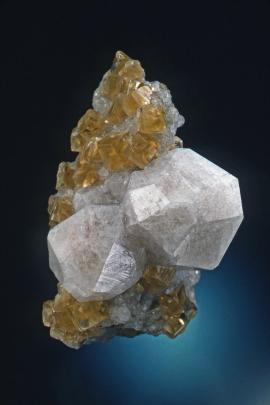 Analcime with calcite, Phoenix Mine, Keweenaw County, Michigan. Analcime with calcite, Phoenix Mine, Keweenaw County, Michigan. Fine analcime crystals on matrix with honey-colored calcite. Donor: D. Gabriel. Specimen 6 cm tall. Photo by J. Scovil. (DCG 1357)