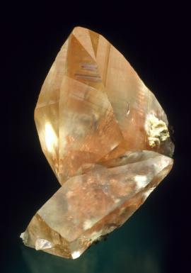 Calcite with native copper inclusions, Quincy Mine, Houghton County, Michigan. Calcite with native copper inclusions, Quincy Mine, Houghton County, Michigan. A superb example of copper included calcite. Donor: D. Gabriel. Specimen 5 cm tall. Photo by J. Scovil. (DCG 1159)