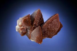 Calcite, Leiping Mine, Hunan, China Calcite, Leiping Mine, Hunan, China. Hematite included calcite from China. Specimen13 cm wide. Photo by C. Stefano. (PJC 05008)