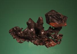 Copper, Central Mine, Keweenaw County, Michigan. Sharp copper crystals with black and red tenorite and cuprite coatings. From the collection of J. T. Reeder. Specimen 6.5 cm wide. Photo by G. Robinson. (JTR 1699)