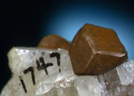 Copper, Franklin Mine, Houghton County, Michigan. Copper, Franklin Mine, Houghton County, Michigan. A sharp dodecahedral crystal of copper on calcite. From the collection of J. T. Reeder. Field of view is about 4 cm wide. Photo by J. Jaszczak. (JTR 1747)