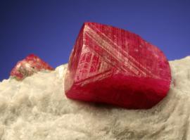 Corundum variety ruby, Jagdalak, Afghanistan. A fine ruby crystal in white marble. Field of view is about 2.5 cm wide. Photo by G. Robinson. (DM 22608)