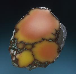 Datolite, Mesnard Mine, Houghton County, Michigan. Datolite, Mesnard Mine, Houghton County, Michigan. A rare datolite nodule with colors zoning from the more common red to the much rarer yellow. Specimen 8 cm tall. Photo by J. Jaszczak. (DM 1489)