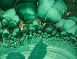 Malachite, Burra Burra, South Australia.  Malachite, Burra Burra, South Australia. Cut and polished slab of stalactitic malachite. Donor: L. T. Hampel. Field of view 4 cm. Photo by G. Robinson. (DM 28731)