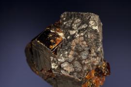 Rhodochrosite after alabandite on wurtzite, Merelani, Arusha, Tanzania.  Rhodochrosite after alabandite on wurtzite, Merelani, Arusha, Tanzania. A one-of-a-kind specimen of rhodochrosite replacing alabandite on wurtzite. The specimen also has some of the finest clausthalite crystals on it. Specimen 3 cm across. Photo by J. Jaszczak. (DM 31181)