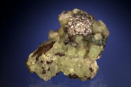 Silver, prehnite and copper, Quincy Mine, Houghton County, Michigan. Silver, prehnite and copper, Quincy Mine, Houghton County, Michigan. An unusual “ball” of silver crystals on a matrix of prehnite and copper. From collection of J. T. Reeder. Specimen 7.5 cm long. Photo by J. Jaszczak and C. Stefano. (JTR 493)