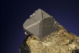 Sperrylite, Broken Hammer Deposit, Sudbury, Ontario, Canada.  Sperrylite, Broken Hammer Deposit, Sudbury, Ontario, Canada. Sperrylite is a rare platinum mineral. Large crystals are known from only a few localities worldwide and some of the best have come from the Broken Hammer Deposit. Donor: R. and C. Sage. Specimen 1.8 cm across. Photo by J. Jaszczak. (DM 31134)