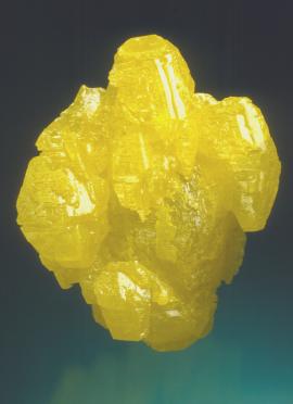 Sulfur, Maybee Quarry, Monroe County, Michigan. Sulfur, Maybee Quarry, Monroe County, Michigan. A large sulfur crystal with some smaller parallel crystals attached. Specimen 5.5 cm tall. Photo by J. Scovil. (DM 23134)