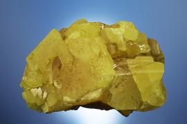 Sulfur, Racalmuto, Agrigento, Sicily, Italy.  Sulfur, Racalmuto, Agrigento, Sicily, Italy. The world’s finest sulfur specimens come from Sicily. This specimen was collected by University of Michigan professor Walter Hunt gifted by Hunt to E. W. Heinrich who in turn gifted his entire collection to the A. E. Seaman Mineral Museum. Donor: E. W. Heinrich. Specimen 11.5 cm wide. Photo by C. Stefano. (DM 24436)