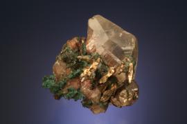 Calcite with copper and silver, Quincy Mine, Houghton County, Michigan. A superb specimen of copper included calcite crystals with silver crystals. From the collection of J. T. Reeder. Specimen 4.5 cm wide. Photo by J. Jaszczak. (JTR 390)
