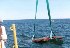 The 19-ton Lake Copper emerging from Lake Superior after being lifted from the bottomlands