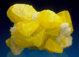 Sulfur, Maybee Quarry, Monroe County, Michigan. A fine crystal group of sulfur with calcite. Maybee sulfurs are easily North America’s finest sulfur specimens. Specimen 8 cm wide. Photo by J. Scovil. (DM 23056)